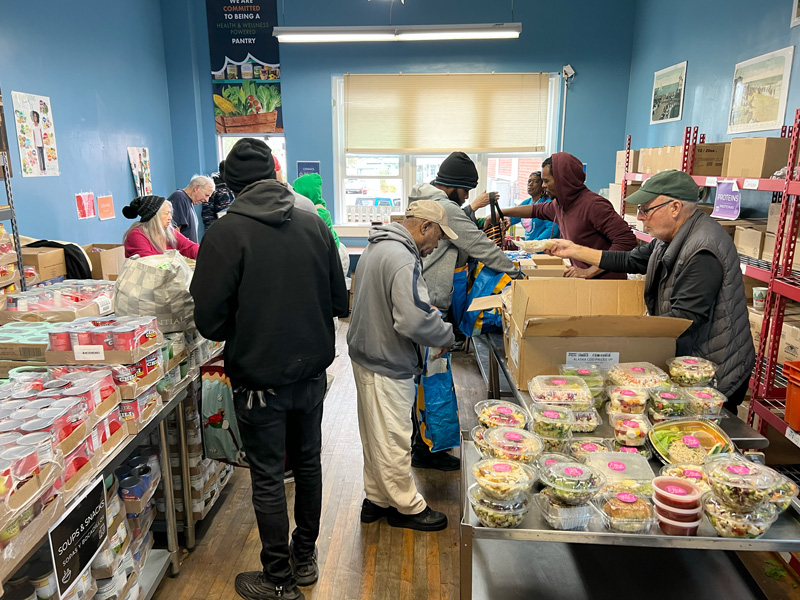 Guests and volunteers in our pantry